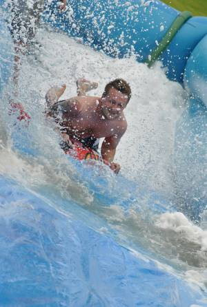 Ilminster Town FC fun day Part 25 – July 9, 2016: A giant water slide was the star attraction at a family fun day held to celebrate Ilminster Town Football Club’s new Archie Gooch Pavilion headquarters in Britten’s Field. Photo 30