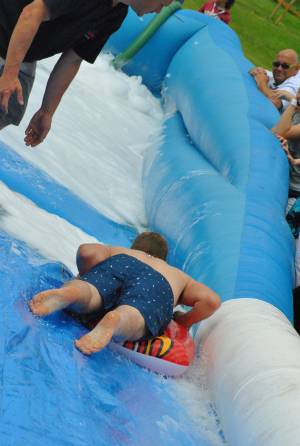 Ilminster Town FC fun day Part 25 – July 9, 2016: A giant water slide was the star attraction at a family fun day held to celebrate Ilminster Town Football Club’s new Archie Gooch Pavilion headquarters in Britten’s Field. Photo 3