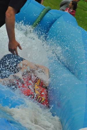 Ilminster Town FC fun day Part 25 – July 9, 2016: A giant water slide was the star attraction at a family fun day held to celebrate Ilminster Town Football Club’s new Archie Gooch Pavilion headquarters in Britten’s Field. Photo 4
