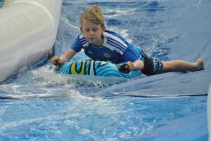 Ilminster Town FC fun day Part 26 – July 9, 2016: A giant water slide was the star attraction at a family fun day held to celebrate Ilminster Town Football Club’s new Archie Gooch Pavilion headquarters in Britten’s Field. Photo 17
