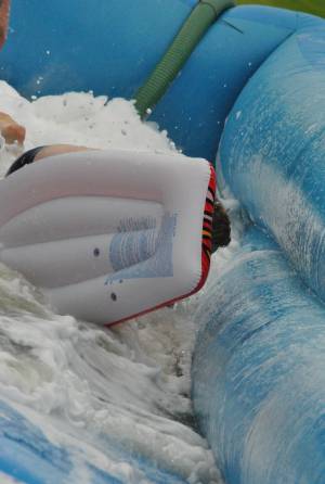 Ilminster Town FC fun day Part 26 – July 9, 2016: A giant water slide was the star attraction at a family fun day held to celebrate Ilminster Town Football Club’s new Archie Gooch Pavilion headquarters in Britten’s Field. Photo 1