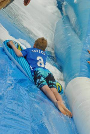 Ilminster Town FC fun day Part 26 – July 9, 2016: A giant water slide was the star attraction at a family fun day held to celebrate Ilminster Town Football Club’s new Archie Gooch Pavilion headquarters in Britten’s Field. Photo 19