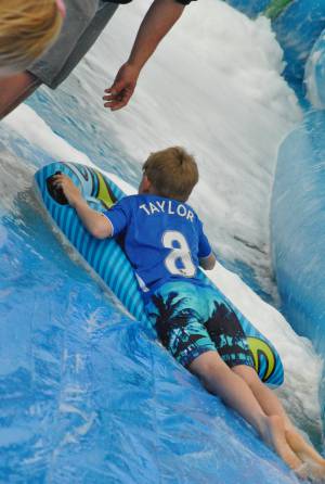 Ilminster Town FC fun day Part 26 – July 9, 2016: A giant water slide was the star attraction at a family fun day held to celebrate Ilminster Town Football Club’s new Archie Gooch Pavilion headquarters in Britten’s Field. Photo 20