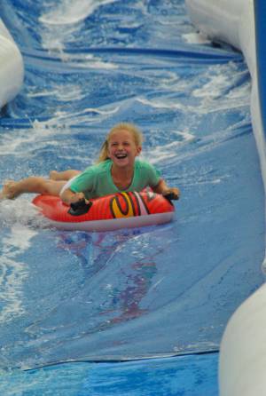 Ilminster Town FC fun day Part 26 – July 9, 2016: A giant water slide was the star attraction at a family fun day held to celebrate Ilminster Town Football Club’s new Archie Gooch Pavilion headquarters in Britten’s Field. Photo 22