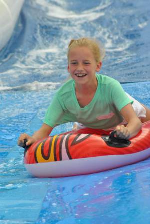 Ilminster Town FC fun day Part 26 – July 9, 2016: A giant water slide was the star attraction at a family fun day held to celebrate Ilminster Town Football Club’s new Archie Gooch Pavilion headquarters in Britten’s Field. Photo 23
