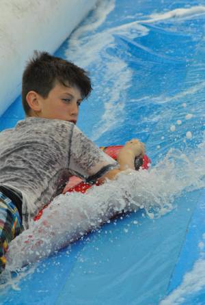 Ilminster Town FC fun day Part 26 – July 9, 2016: A giant water slide was the star attraction at a family fun day held to celebrate Ilminster Town Football Club’s new Archie Gooch Pavilion headquarters in Britten’s Field. Photo 24