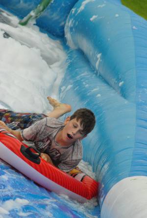 Ilminster Town FC fun day Part 26 – July 9, 2016: A giant water slide was the star attraction at a family fun day held to celebrate Ilminster Town Football Club’s new Archie Gooch Pavilion headquarters in Britten’s Field. Photo 25