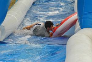 Ilminster Town FC fun day Part 26 – July 9, 2016: A giant water slide was the star attraction at a family fun day held to celebrate Ilminster Town Football Club’s new Archie Gooch Pavilion headquarters in Britten’s Field. Photo 26