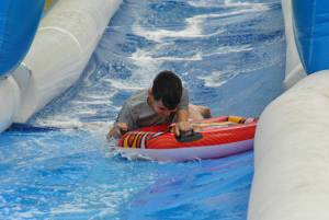 Ilminster Town FC fun day Part 26 – July 9, 2016: A giant water slide was the star attraction at a family fun day held to celebrate Ilminster Town Football Club’s new Archie Gooch Pavilion headquarters in Britten’s Field. Photo 27
