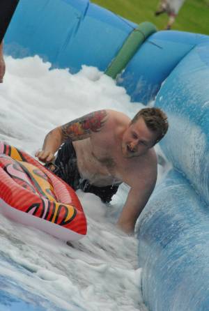 Ilminster Town FC fun day Part 26 – July 9, 2016: A giant water slide was the star attraction at a family fun day held to celebrate Ilminster Town Football Club’s new Archie Gooch Pavilion headquarters in Britten’s Field. Photo 2