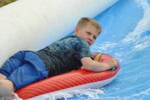Ilminster Town FC fun day Part 26 – July 9, 2016: A giant water slide was the star attraction at a family fun day held to celebrate Ilminster Town Football Club’s new Archie Gooch Pavilion headquarters in Britten’s Field. Photo 29