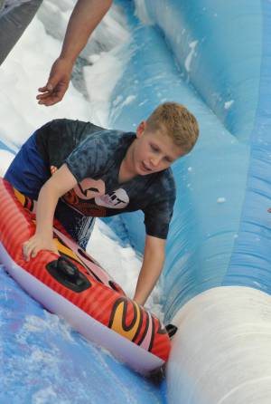 Ilminster Town FC fun day Part 26 – July 9, 2016: A giant water slide was the star attraction at a family fun day held to celebrate Ilminster Town Football Club’s new Archie Gooch Pavilion headquarters in Britten’s Field. Photo 30