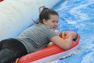 Ilminster Town FC fun day Part 26 – July 9, 2016: A giant water slide was the star attraction at a family fun day held to celebrate Ilminster Town Football Club’s new Archie Gooch Pavilion headquarters in Britten’s Field. Photo 3