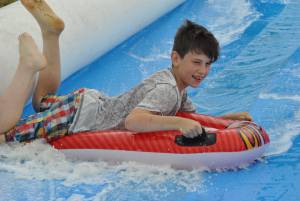 Ilminster Town FC fun day Part 26 – July 9, 2016: A giant water slide was the star attraction at a family fun day held to celebrate Ilminster Town Football Club’s new Archie Gooch Pavilion headquarters in Britten’s Field. Photo 4
