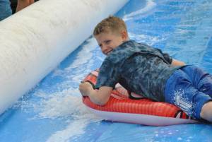 Ilminster Town FC fun day Part 26 – July 9, 2016: A giant water slide was the star attraction at a family fun day held to celebrate Ilminster Town Football Club’s new Archie Gooch Pavilion headquarters in Britten’s Field. Photo 6