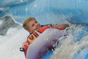 Ilminster Town FC fun day Part 26 – July 9, 2016: A giant water slide was the star attraction at a family fun day held to celebrate Ilminster Town Football Club’s new Archie Gooch Pavilion headquarters in Britten’s Field. Photo 7