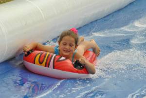 Ilminster Town FC fun day Part 27 – July 9, 2016: A giant water slide was the star attraction at a family fun day held to celebrate Ilminster Town Football Club’s new Archie Gooch Pavilion headquarters in Britten’s Field. Photo 10