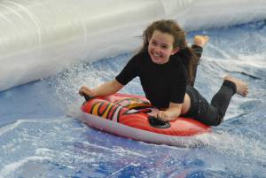 Ilminster Town FC fun day Part 27 – July 9, 2016: A giant water slide was the star attraction at a family fun day held to celebrate Ilminster Town Football Club’s new Archie Gooch Pavilion headquarters in Britten’s Field. Photo 11