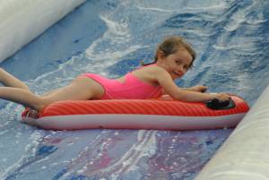 Ilminster Town FC fun day Part 27 – July 9, 2016: A giant water slide was the star attraction at a family fun day held to celebrate Ilminster Town Football Club’s new Archie Gooch Pavilion headquarters in Britten’s Field. Photo 12