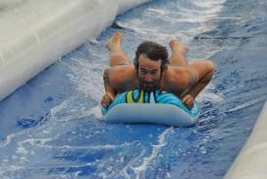 Ilminster Town FC fun day Part 27 – July 9, 2016: A giant water slide was the star attraction at a family fun day held to celebrate Ilminster Town Football Club’s new Archie Gooch Pavilion headquarters in Britten’s Field. Photo 14