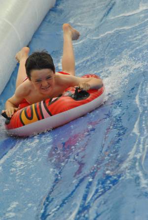 Ilminster Town FC fun day Part 27 – July 9, 2016: A giant water slide was the star attraction at a family fun day held to celebrate Ilminster Town Football Club’s new Archie Gooch Pavilion headquarters in Britten’s Field. Photo 20