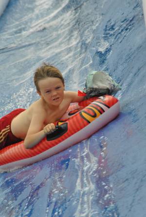 Ilminster Town FC fun day Part 27 – July 9, 2016: A giant water slide was the star attraction at a family fun day held to celebrate Ilminster Town Football Club’s new Archie Gooch Pavilion headquarters in Britten’s Field. Photo 21
