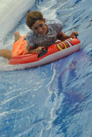 Ilminster Town FC fun day Part 27 – July 9, 2016: A giant water slide was the star attraction at a family fun day held to celebrate Ilminster Town Football Club’s new Archie Gooch Pavilion headquarters in Britten’s Field. Photo 22