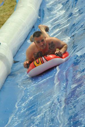 Ilminster Town FC fun day Part 27 – July 9, 2016: A giant water slide was the star attraction at a family fun day held to celebrate Ilminster Town Football Club’s new Archie Gooch Pavilion headquarters in Britten’s Field. Photo 24