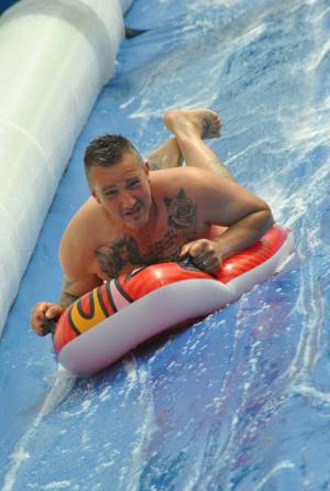 Ilminster Town FC fun day Part 27 – July 9, 2016: A giant water slide was the star attraction at a family fun day held to celebrate Ilminster Town Football Club’s new Archie Gooch Pavilion headquarters in Britten’s Field. Photo 25