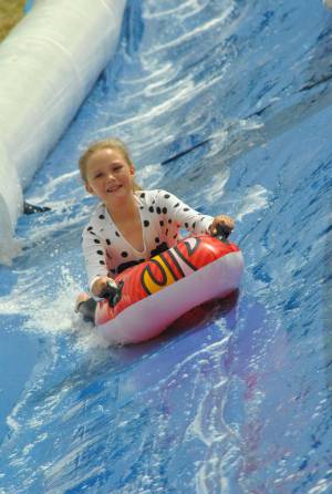 Ilminster Town FC fun day Part 27 – July 9, 2016: A giant water slide was the star attraction at a family fun day held to celebrate Ilminster Town Football Club’s new Archie Gooch Pavilion headquarters in Britten’s Field. Photo 26