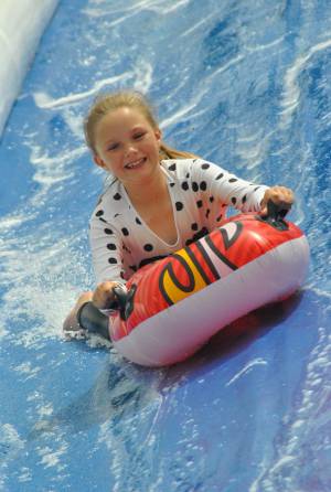 Ilminster Town FC fun day Part 27 – July 9, 2016: A giant water slide was the star attraction at a family fun day held to celebrate Ilminster Town Football Club’s new Archie Gooch Pavilion headquarters in Britten’s Field. Photo 27