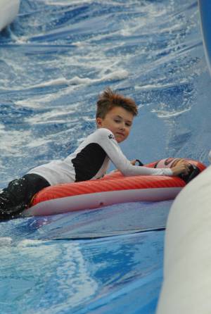 Ilminster Town FC fun day Part 27 – July 9, 2016: A giant water slide was the star attraction at a family fun day held to celebrate Ilminster Town Football Club’s new Archie Gooch Pavilion headquarters in Britten’s Field. Photo 2