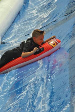Ilminster Town FC fun day Part 27 – July 9, 2016: A giant water slide was the star attraction at a family fun day held to celebrate Ilminster Town Football Club’s new Archie Gooch Pavilion headquarters in Britten’s Field. Photo 28