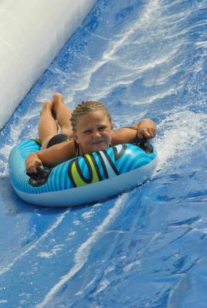 Ilminster Town FC fun day Part 27 – July 9, 2016: A giant water slide was the star attraction at a family fun day held to celebrate Ilminster Town Football Club’s new Archie Gooch Pavilion headquarters in Britten’s Field. Photo 30