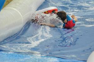 Ilminster Town FC fun day Part 27 – July 9, 2016: A giant water slide was the star attraction at a family fun day held to celebrate Ilminster Town Football Club’s new Archie Gooch Pavilion headquarters in Britten’s Field. Photo 3