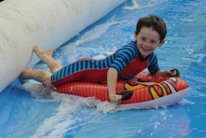 Ilminster Town FC fun day Part 27 – July 9, 2016: A giant water slide was the star attraction at a family fun day held to celebrate Ilminster Town Football Club’s new Archie Gooch Pavilion headquarters in Britten’s Field. Photo 5
