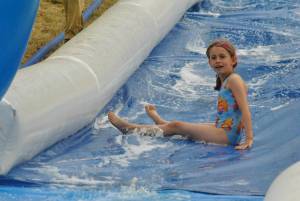 Ilminster Town FC fun day Part 27 – July 9, 2016: A giant water slide was the star attraction at a family fun day held to celebrate Ilminster Town Football Club’s new Archie Gooch Pavilion headquarters in Britten’s Field. Photo 6
