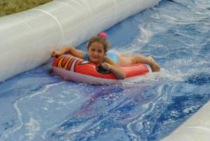 Ilminster Town FC fun day Part 27 – July 9, 2016: A giant water slide was the star attraction at a family fun day held to celebrate Ilminster Town Football Club’s new Archie Gooch Pavilion headquarters in Britten’s Field. Photo 9