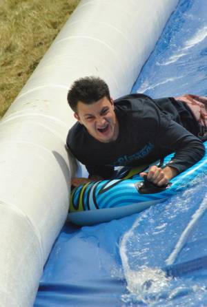Ilminster Town FC fun day Part 28 – July 9, 2016: A giant water slide was the star attraction at a family fun day held to celebrate Ilminster Town Football Club’s new Archie Gooch Pavilion headquarters in Britten’s Field. Photo 12