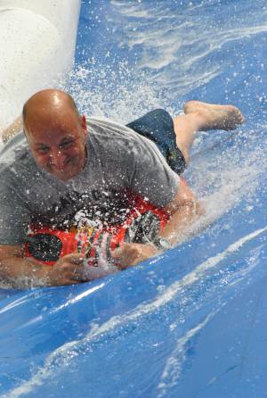 Ilminster Town FC fun day Part 28 – July 9, 2016: A giant water slide was the star attraction at a family fun day held to celebrate Ilminster Town Football Club’s new Archie Gooch Pavilion headquarters in Britten’s Field. Photo 14
