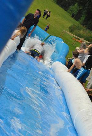 Ilminster Town FC fun day Part 28 – July 9, 2016: A giant water slide was the star attraction at a family fun day held to celebrate Ilminster Town Football Club’s new Archie Gooch Pavilion headquarters in Britten’s Field. Photo 15
