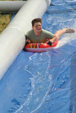 Ilminster Town FC fun day Part 28 – July 9, 2016: A giant water slide was the star attraction at a family fun day held to celebrate Ilminster Town Football Club’s new Archie Gooch Pavilion headquarters in Britten’s Field. Photo 16