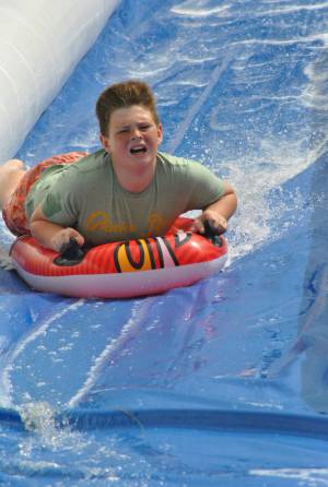 Ilminster Town FC fun day Part 28 – July 9, 2016: A giant water slide was the star attraction at a family fun day held to celebrate Ilminster Town Football Club’s new Archie Gooch Pavilion headquarters in Britten’s Field. Photo 17