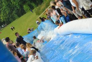 Ilminster Town FC fun day Part 28 – July 9, 2016: A giant water slide was the star attraction at a family fun day held to celebrate Ilminster Town Football Club’s new Archie Gooch Pavilion headquarters in Britten’s Field. Photo 19