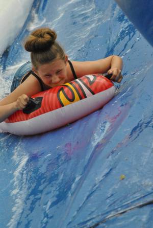 Ilminster Town FC fun day Part 28 – July 9, 2016: A giant water slide was the star attraction at a family fun day held to celebrate Ilminster Town Football Club’s new Archie Gooch Pavilion headquarters in Britten’s Field. Photo 24