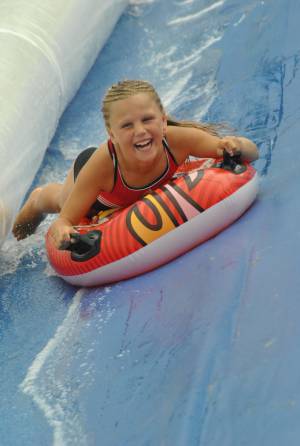 Ilminster Town FC fun day Part 28 – July 9, 2016: A giant water slide was the star attraction at a family fun day held to celebrate Ilminster Town Football Club’s new Archie Gooch Pavilion headquarters in Britten’s Field. Photo 25