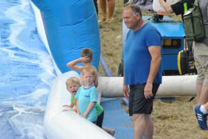 Ilminster Town FC fun day Part 28 – July 9, 2016: A giant water slide was the star attraction at a family fun day held to celebrate Ilminster Town Football Club’s new Archie Gooch Pavilion headquarters in Britten’s Field. Photo 27