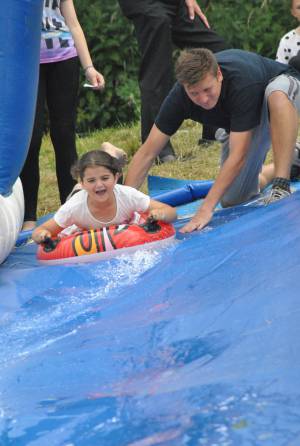 Ilminster Town FC fun day Part 28 – July 9, 2016: A giant water slide was the star attraction at a family fun day held to celebrate Ilminster Town Football Club’s new Archie Gooch Pavilion headquarters in Britten’s Field. Photo 28