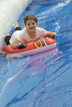 Ilminster Town FC fun day Part 28 – July 9, 2016: A giant water slide was the star attraction at a family fun day held to celebrate Ilminster Town Football Club’s new Archie Gooch Pavilion headquarters in Britten’s Field. Photo 29