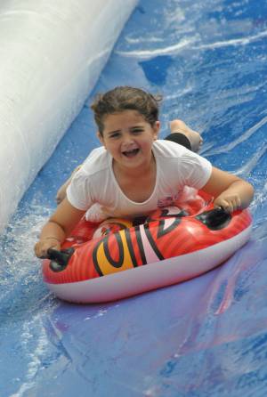 Ilminster Town FC fun day Part 28 – July 9, 2016: A giant water slide was the star attraction at a family fun day held to celebrate Ilminster Town Football Club’s new Archie Gooch Pavilion headquarters in Britten’s Field. Photo 30